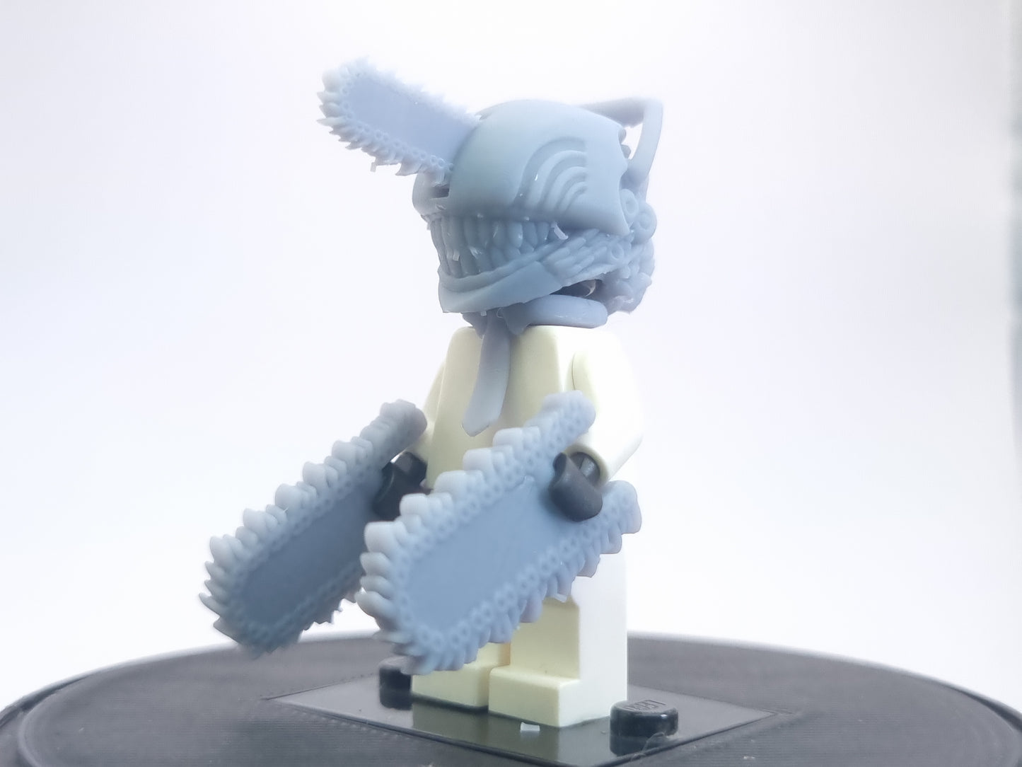 Custom lego compatible dude with chainsaws everwhere!