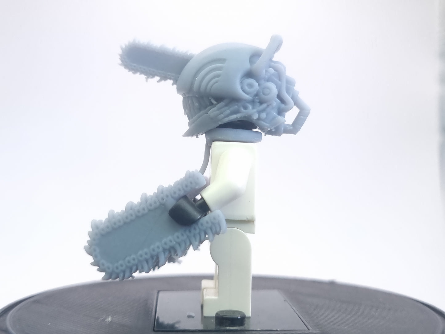 Custom lego compatible dude with chainsaws everwhere!
