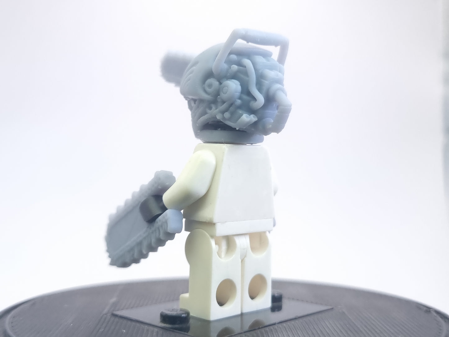 Custom lego compatible dude with chainsaws everwhere!