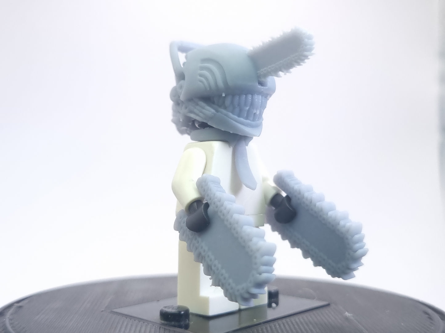 Custom lego compatible dude with chainsaws everwhere!