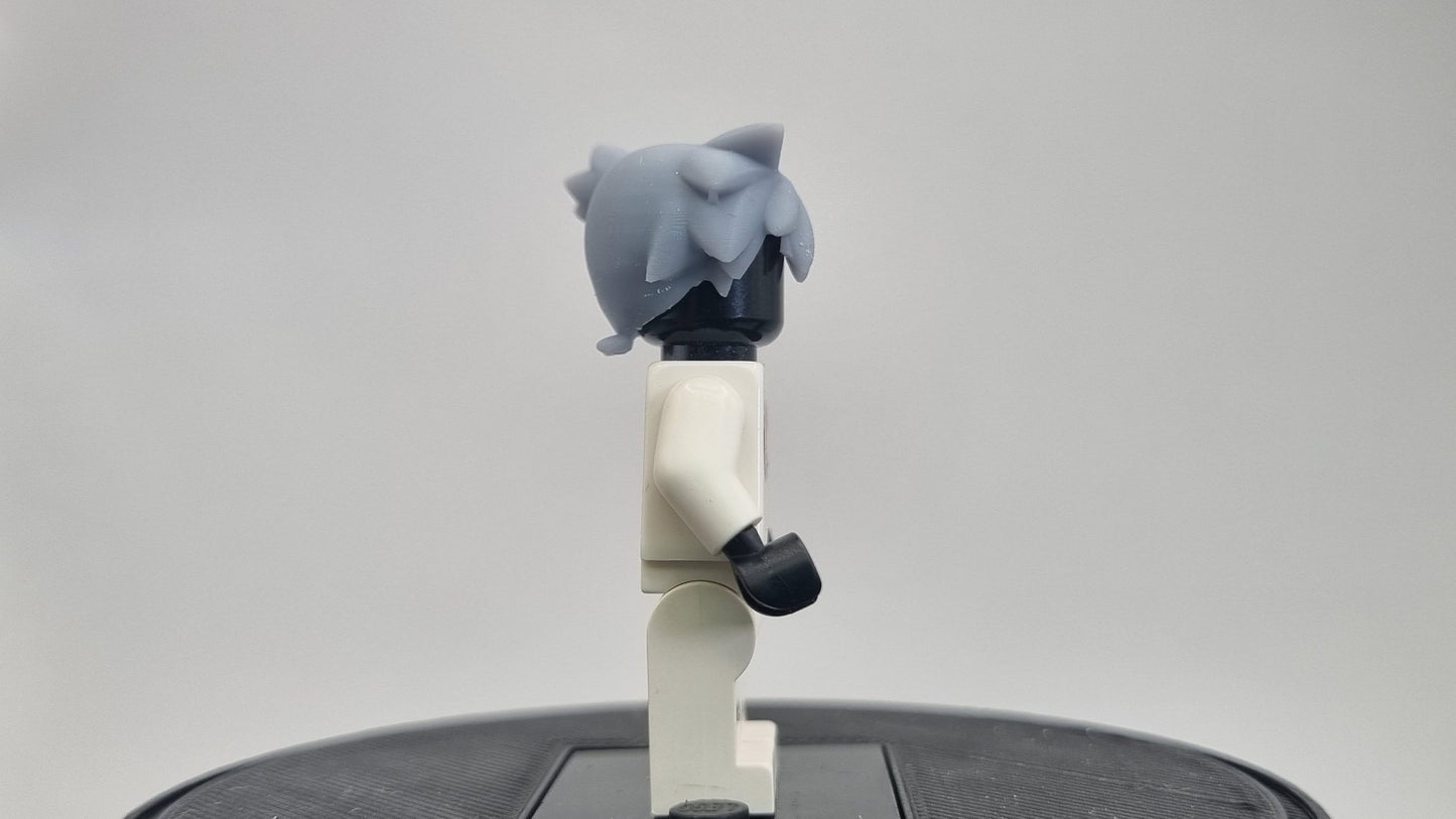 Custom 3D printed building toy animals to catch trainer with orange hair!