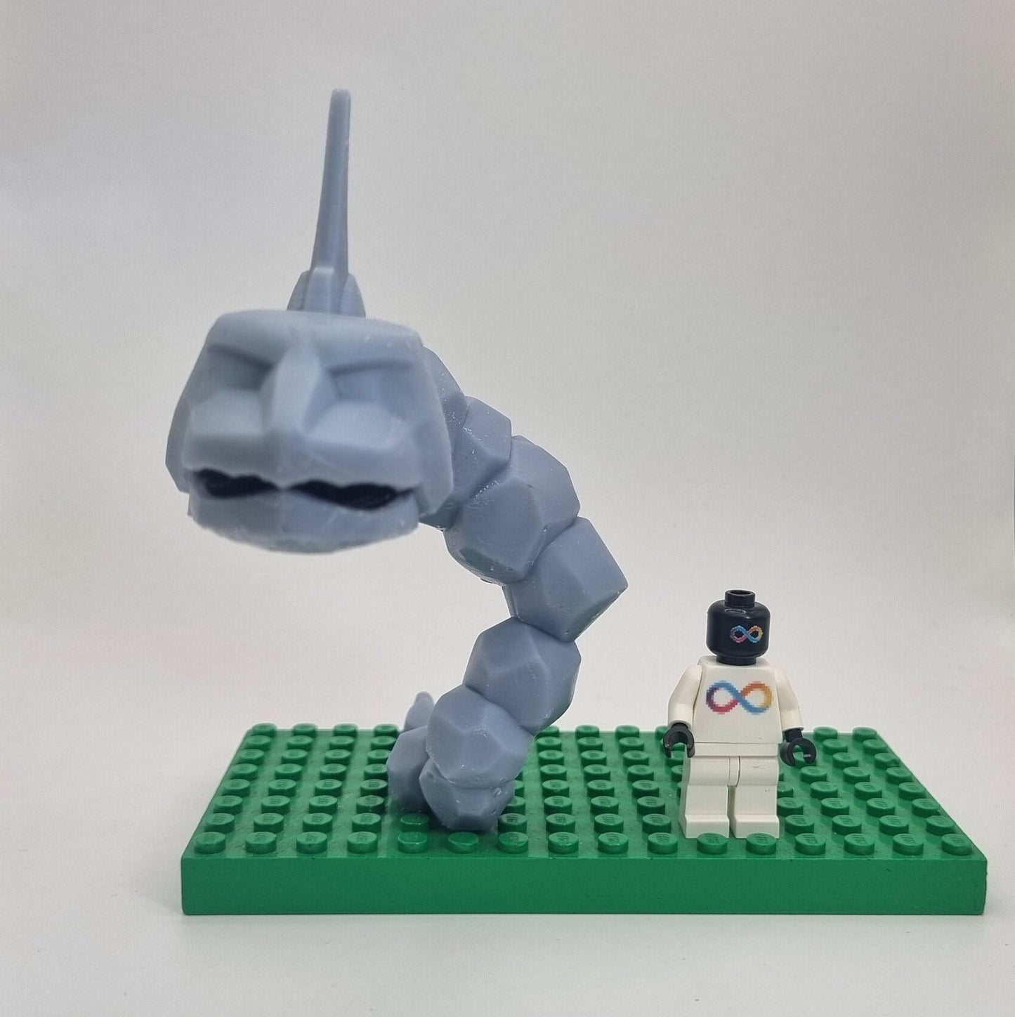 Custom 3D printed building toy animal to catch together clamped rocks!