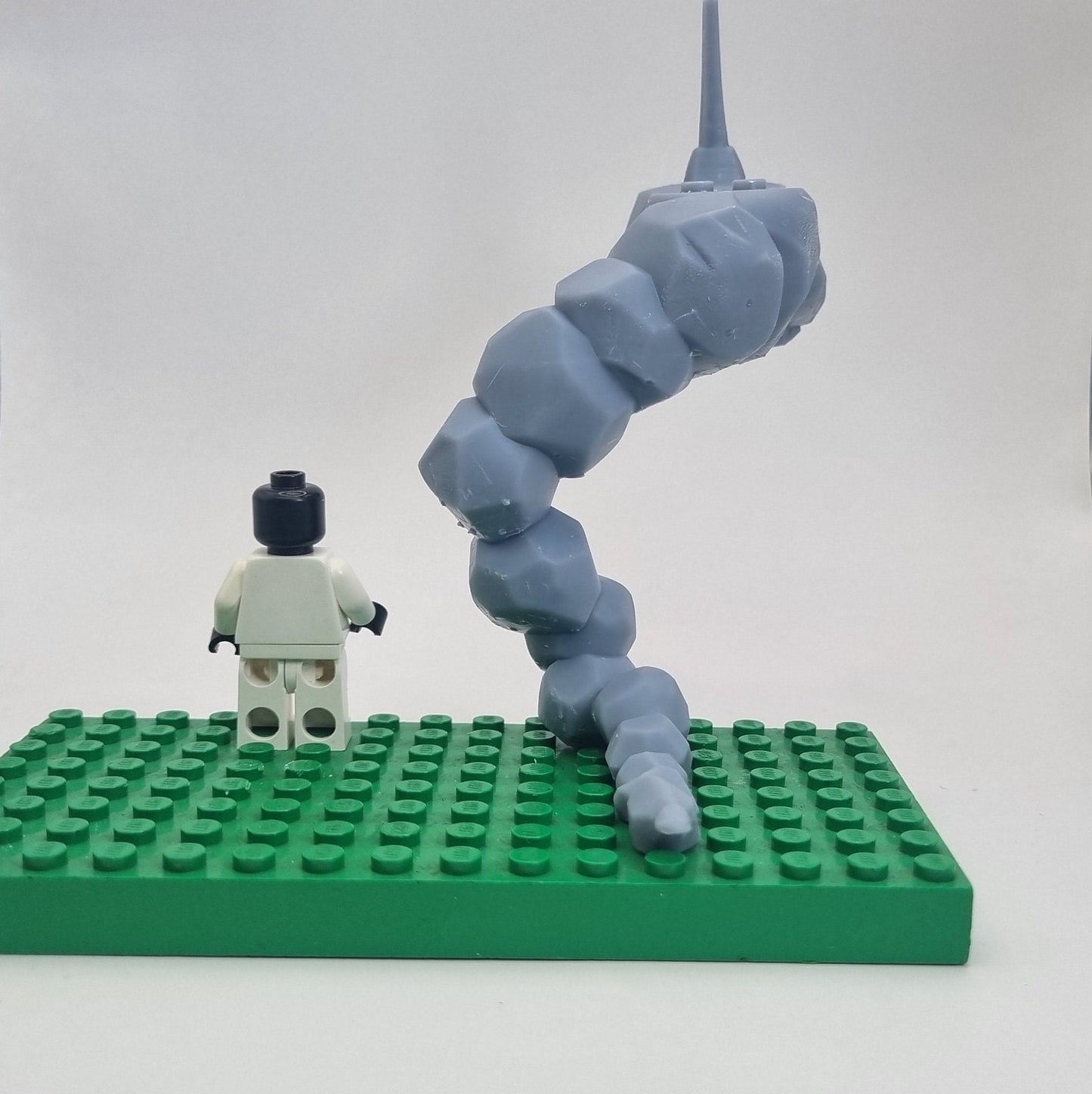 Custom 3D printed building toy animal to catch together clamped rocks!