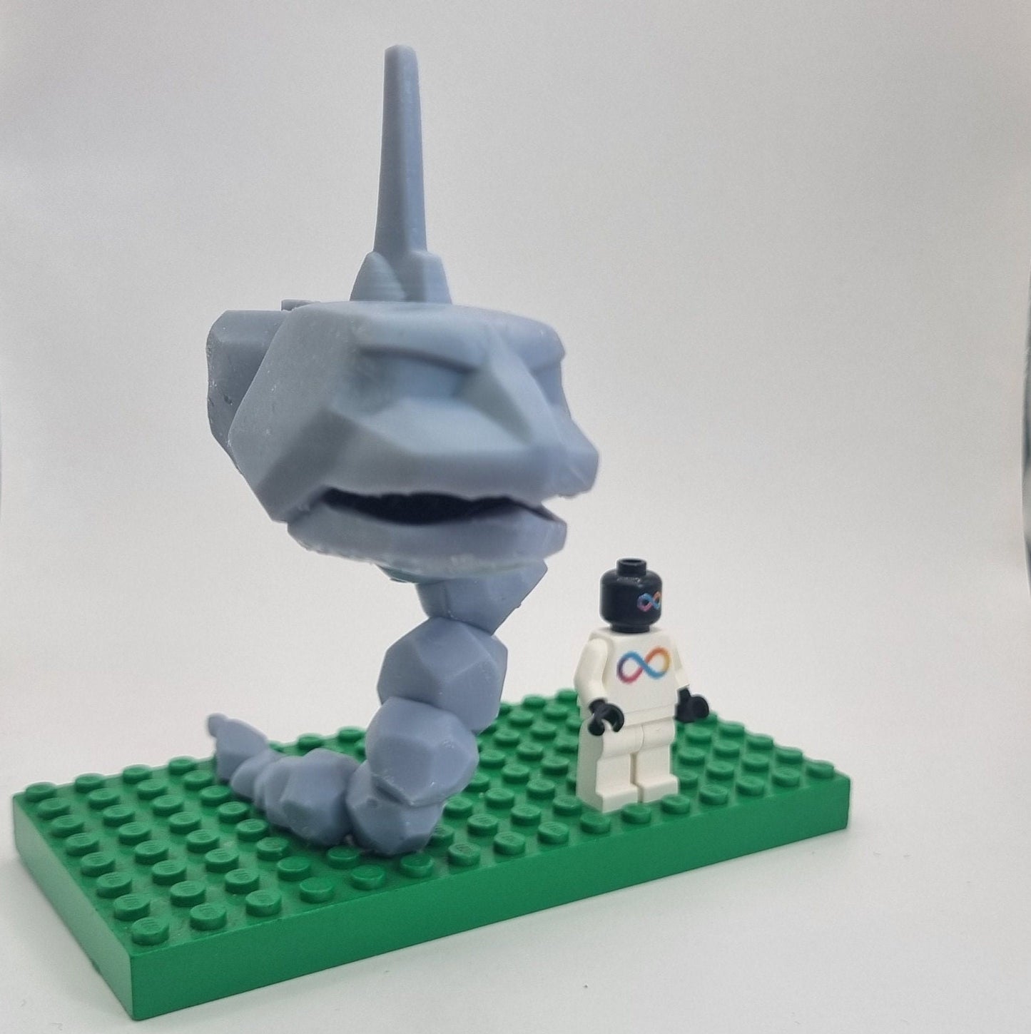 Custom 3D printed building toy animal to catch together clamped rocks!
