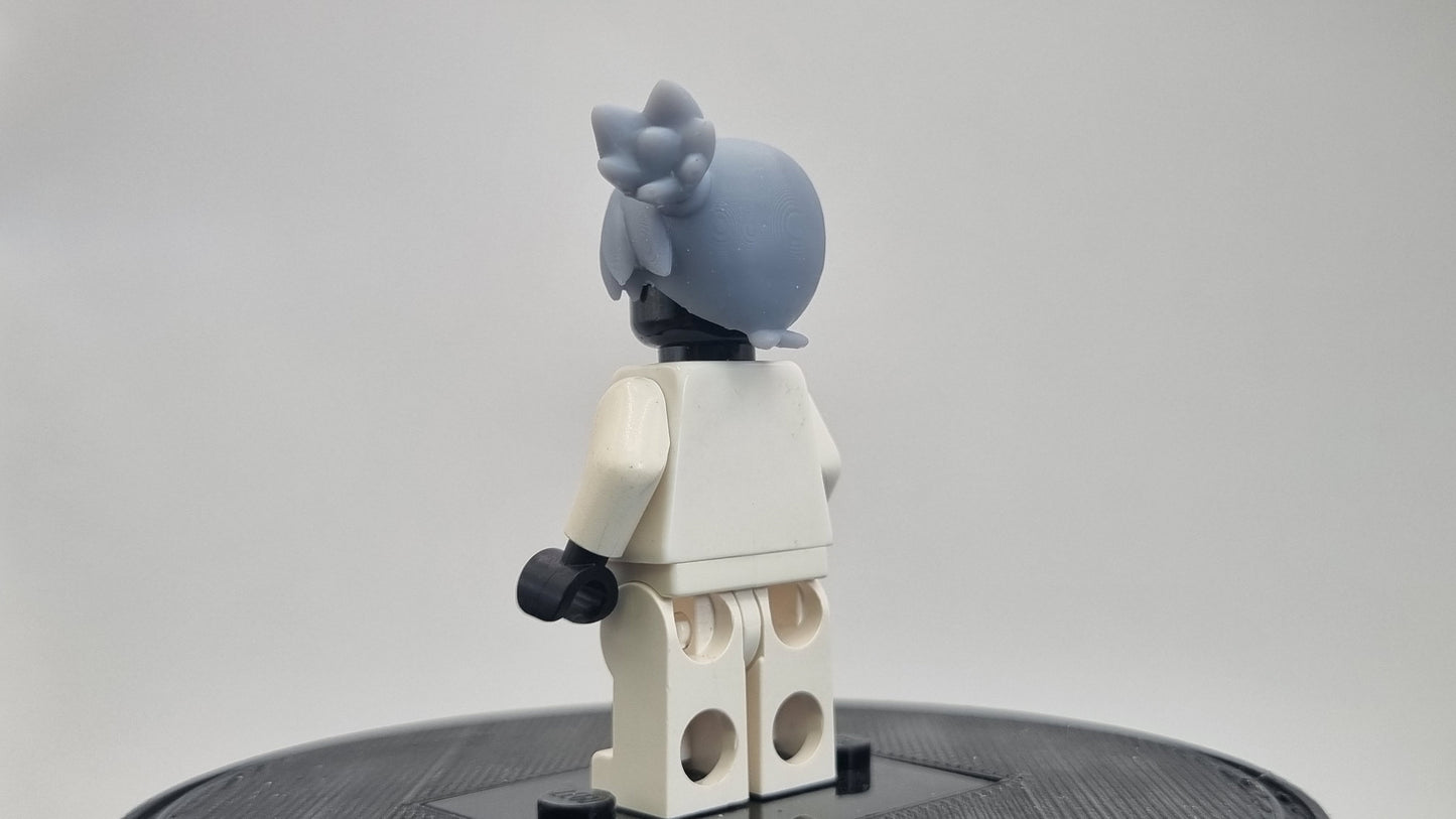 Custom 3D printed building toy animals to catch trainer with orange hair!