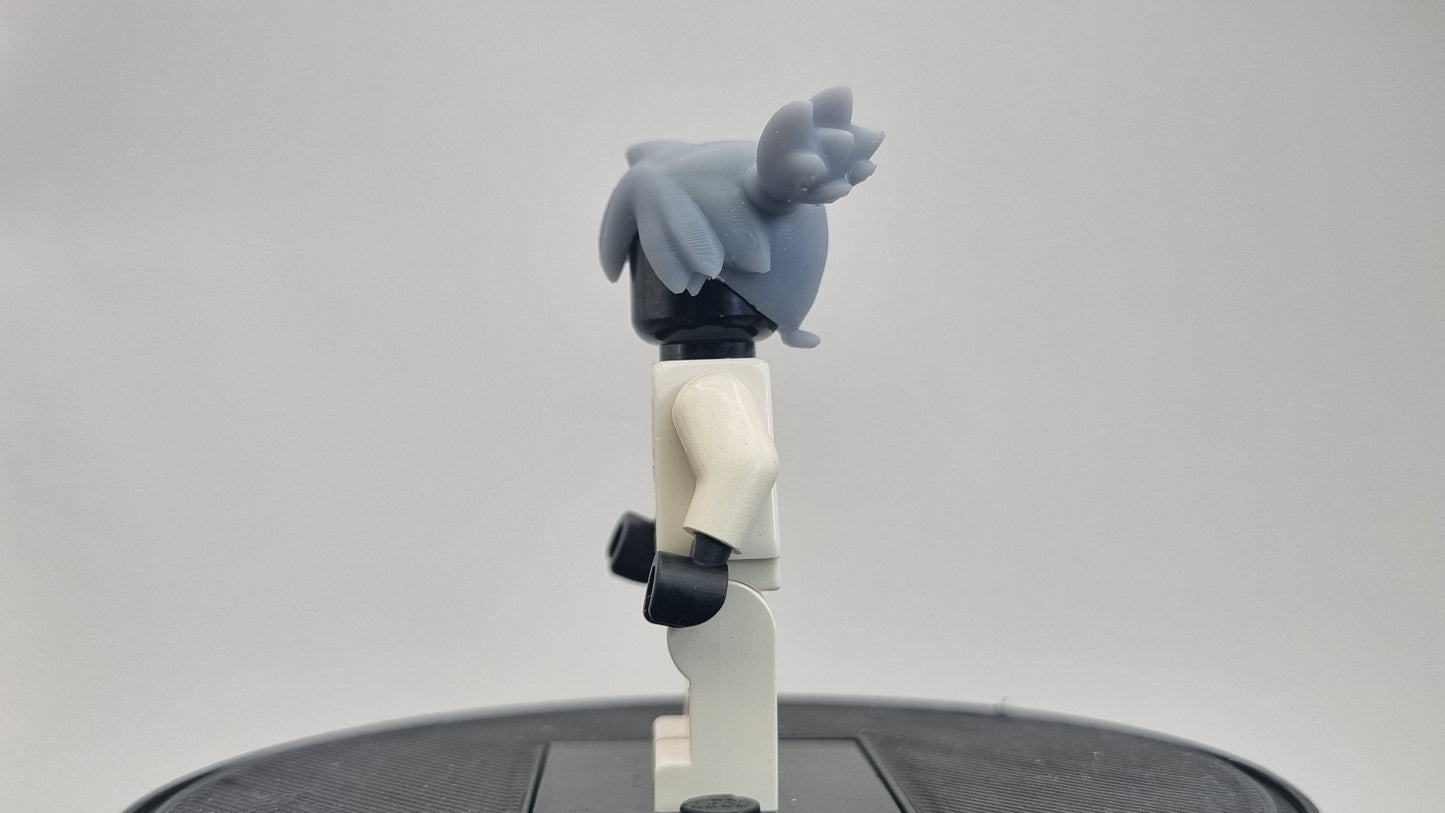 Custom 3D printed building toy animals to catch trainer with orange hair!