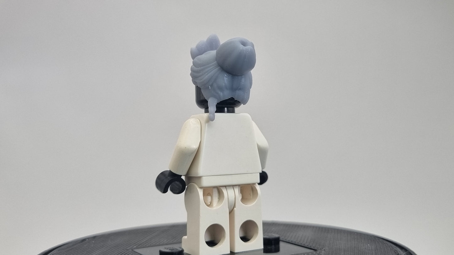 Custom 3D printed building toy princes with a love for frogs hairpiece!