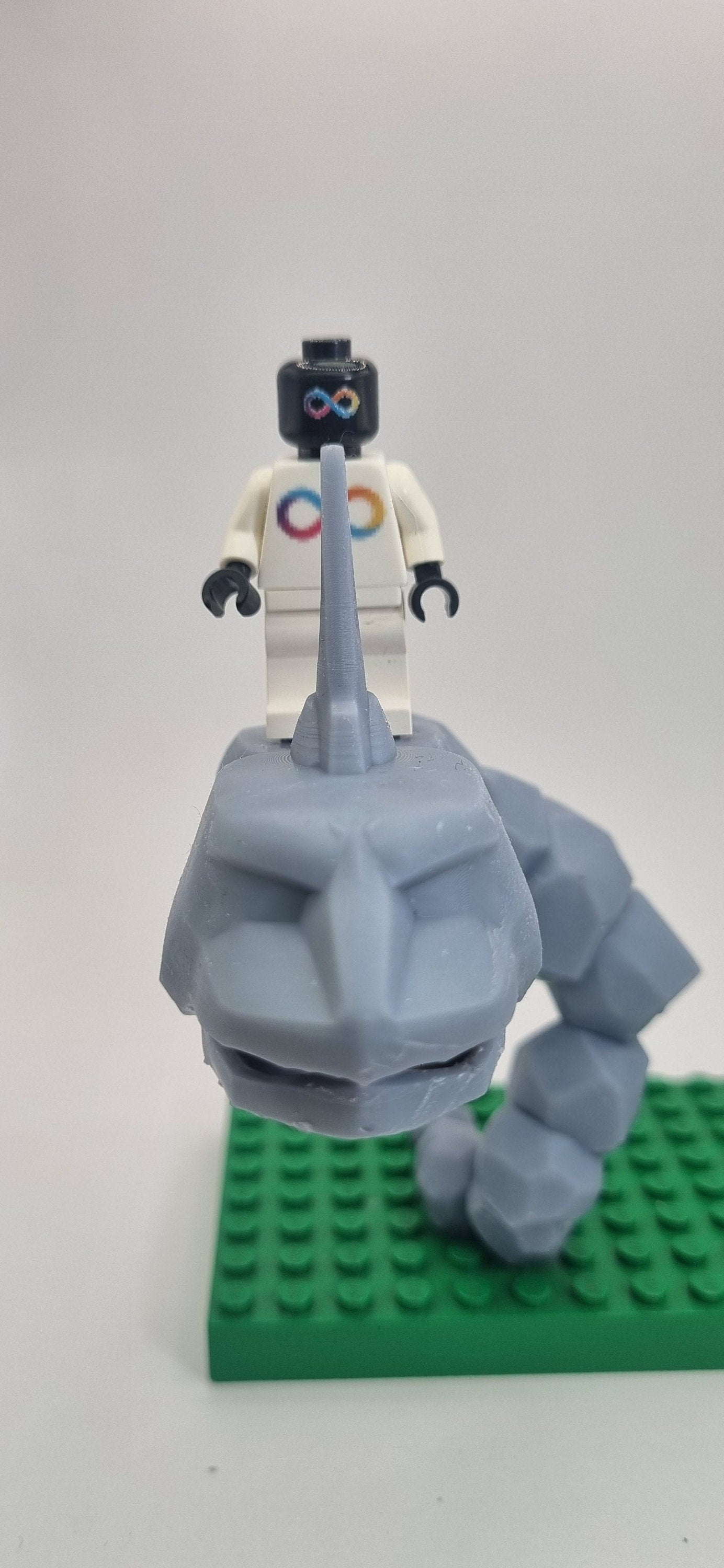 Custom 3D printed building toy animal to catch together clamped rocks!
