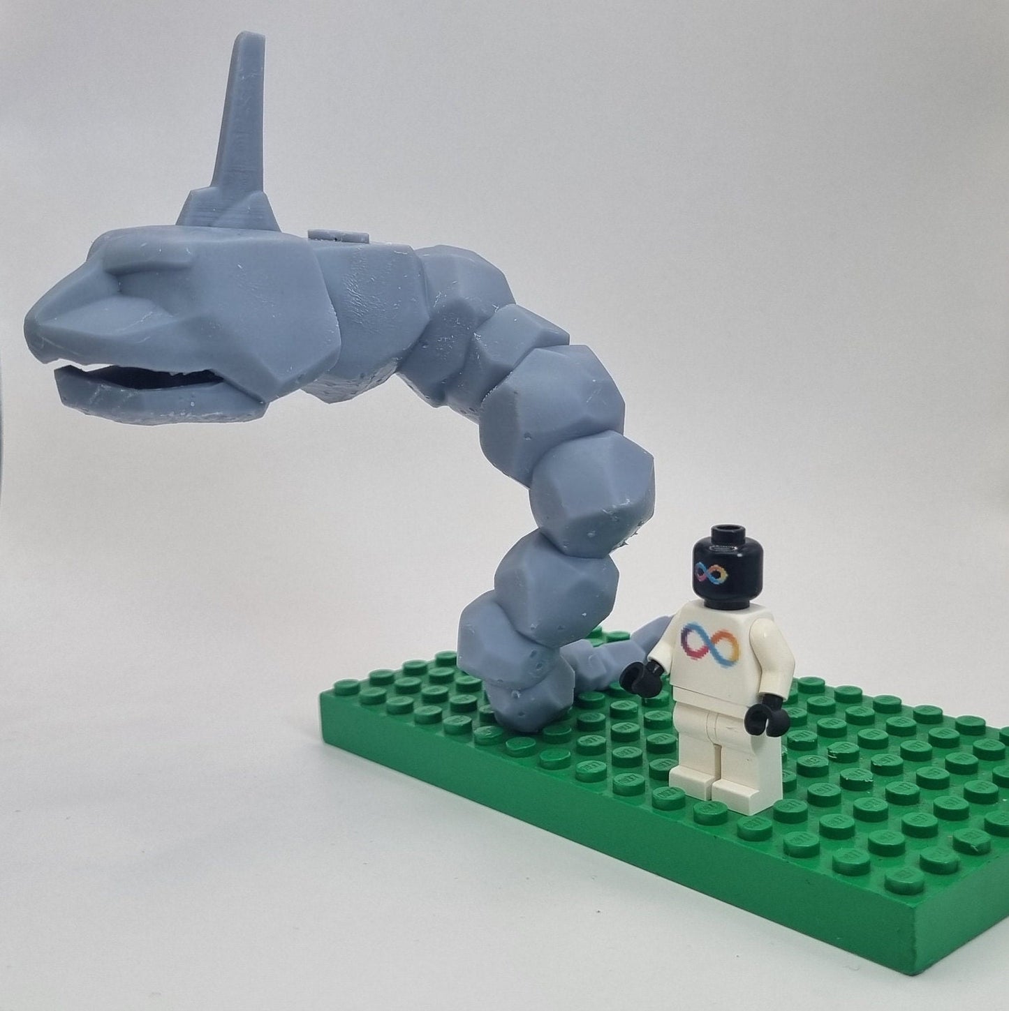 Custom 3D printed building toy animal to catch together clamped rocks!