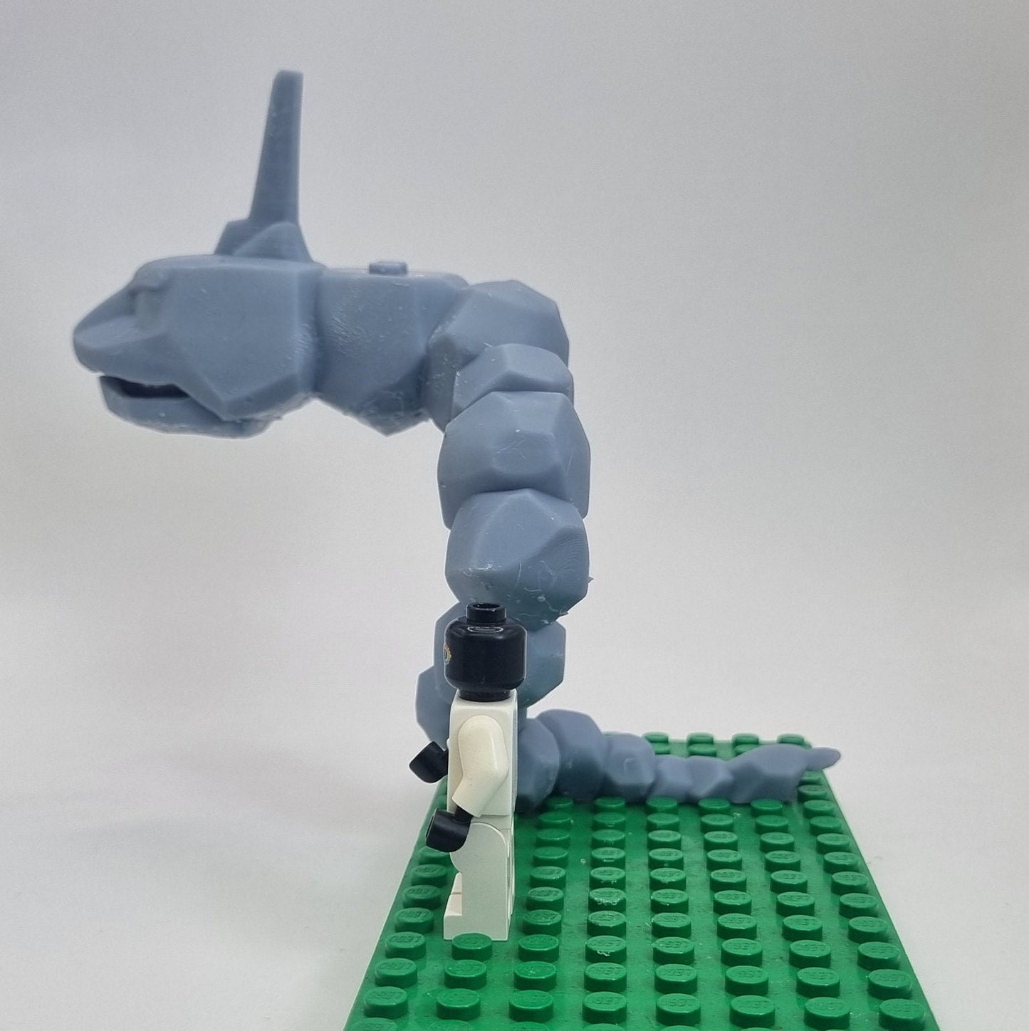 Custom 3D printed building toy animal to catch together clamped rocks!