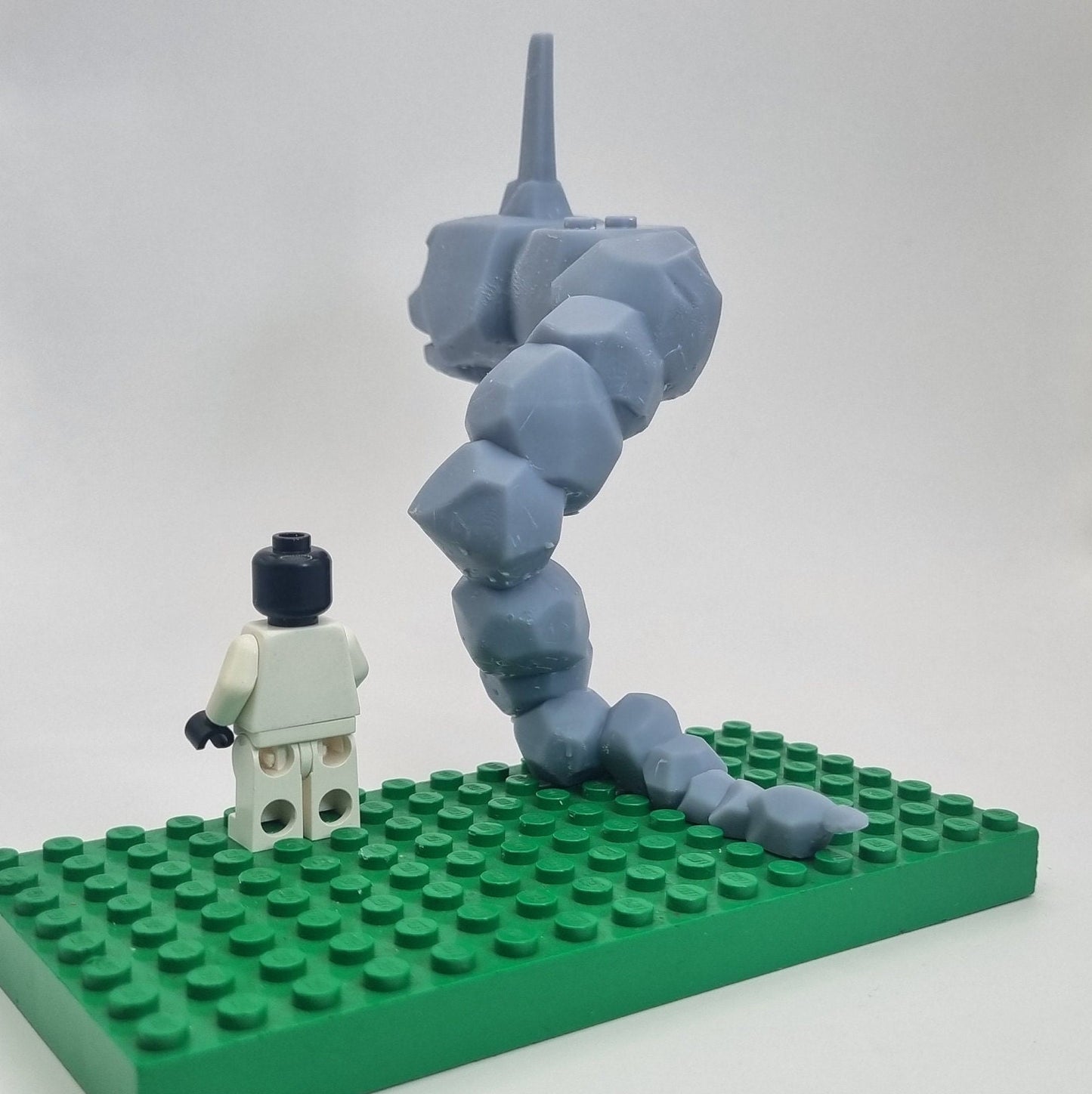 Custom 3D printed building toy animal to catch together clamped rocks!