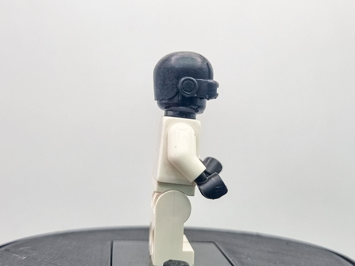 Building toy custom 3D printed bald caped hero with laser eyes
