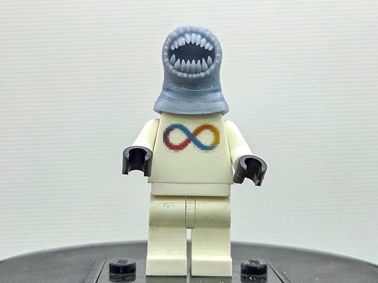 Custom 3D printed alien with a lot of teeth wearing yellow ring