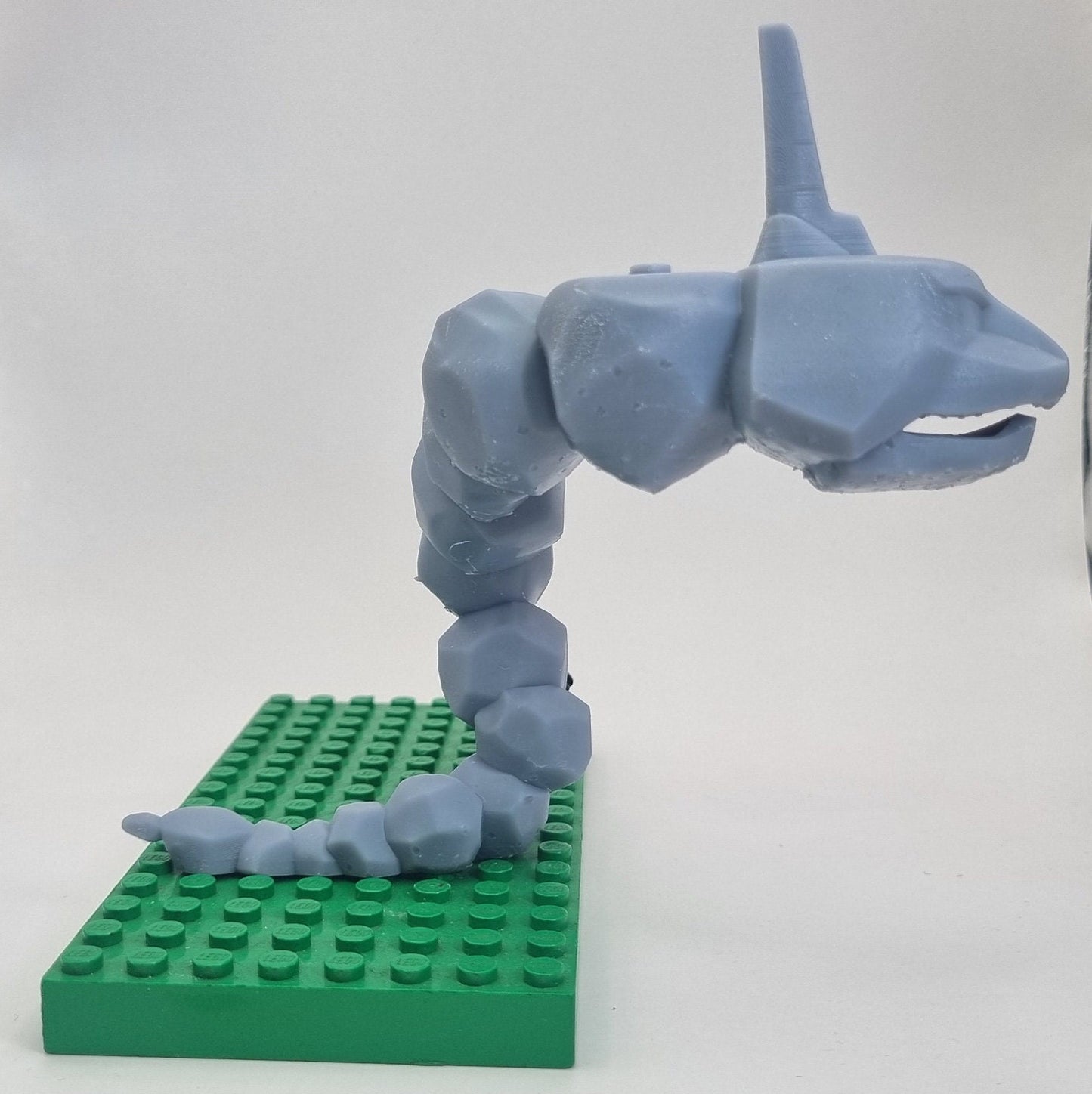Custom 3D printed building toy animal to catch together clamped rocks!