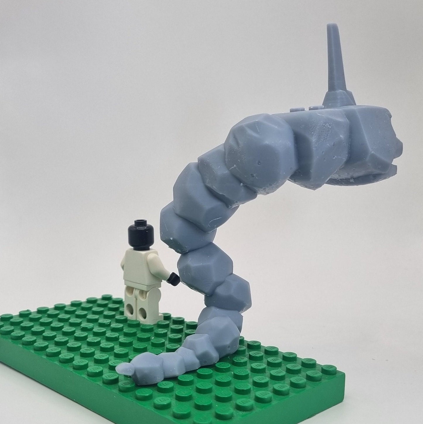 Custom 3D printed building toy animal to catch together clamped rocks!